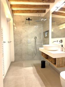 a bathroom with a sink and a shower in it at Casa Sol in Denia
