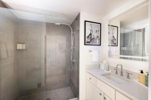 a bathroom with a shower and a sink at The Evalina Hotel in Portland +58 photos