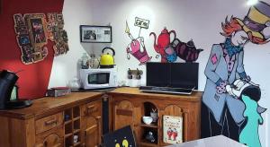 a room with a counter with a microwave and a microwave at La Berlingote in Cherbourg en Cotentin