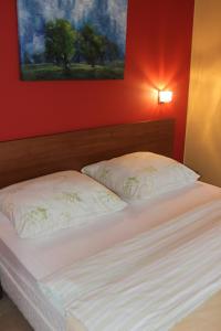 Un pat sau paturi într-o cameră la Tatry Golf Apartmán