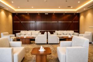 a waiting room with couches and tables at فندق دارك بارك حي الشاطئ Darak Park Hotel Jeddah in Jeddah