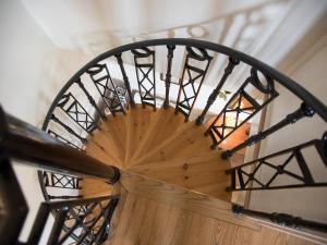 an overhead view of a wooden spiral staircase at Lawson's Studio in Redmire
