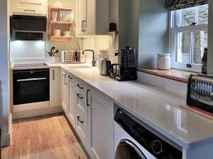 a kitchen with a white counter top with a appliance at Lawson's Studio in Redmire