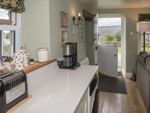 a kitchen with a counter with a coffee maker on it at Lawson's Studio in Redmire