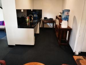 a kitchen with a sink and a counter top at Villa Yuvin in Matara