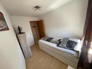 a bedroom with a bed with a spider on the ceiling at Ferienwohnung Matthias Lang in Rugendorf