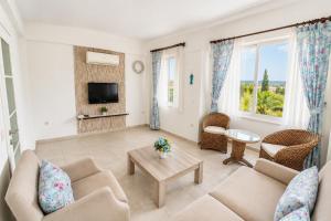 a living room with a couch and a table at Villa Garden Island in Dalyan