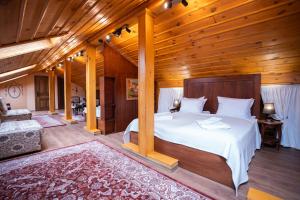 a bedroom with a bed in a wooden room at RAHAT Guest House in Old Town - Free Private Parking in Plovdiv +95 photos