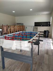 a ping pong table in the middle of a room at Quinta El Encuentro Junín in Junín
