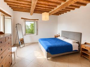 a bedroom with a bed and a dresser and a window at Foxes house in Monte Fabbri