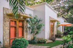 Vonkajšia záhrada v ubytovaní Acacia Tree Garden Hotel