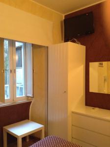 Televízia a/alebo spoločenská miestnosť v ubytovaní B&B In Piazza