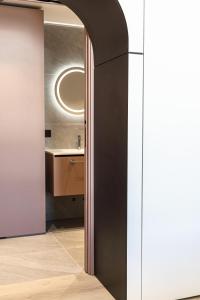 a bathroom with a black door and a sink at Palatium Riccione Suite in Riccione +76 photos