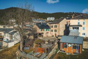 an aerial view of a small town with buildings at La Ferme Des Astres in Les Angles
