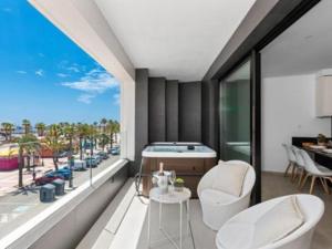 a room with a large window with a bed and a view at Elegance Apartment "Junogu" in San Pedro del Pinatar