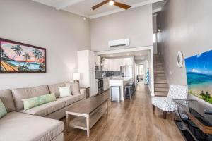 a living room with a couch and a table at 257 Hale Kamaole in Wailea