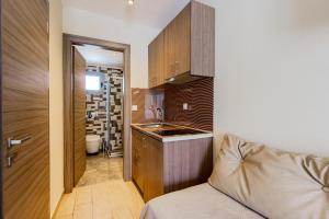 a small kitchen with a sink and a counter at Studios Sotiria in Limenas