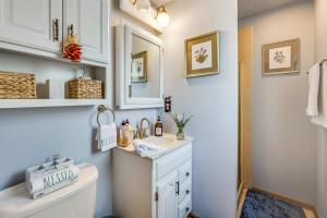 a bathroom with a white sink and a toilet at Eclectic Multi-Level Charmer! 2 Mi to CU Boulder in Boulder +21 photos