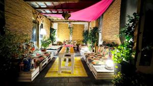 a room with couches and plants in a building at Willa Opal , 250 m do morza in Grzybowo