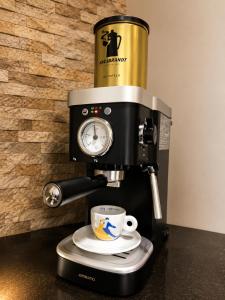 a coffee maker with a cup on top of it at Agape C-52 in Trebinje