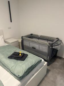 a suitcase sitting on a bed in a room at MelSun Apartment in Melsungen