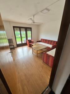 a living room with a couch and a table at Breze Away in Tuzla +17 photos