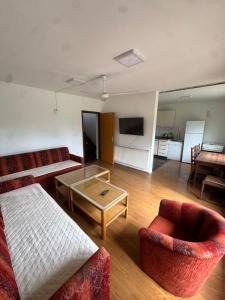 a living room with a couch and a coffee table at Breze Away in Tuzla