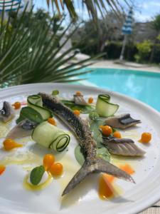 a plate of food with a starfish and vegetables at Hotel Sporting in Vasto