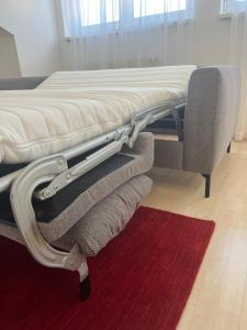a bed frame with a mattress and towels on it at Helles, großzügiges Loft mit Fernblick in Siegendorf im Burgenland