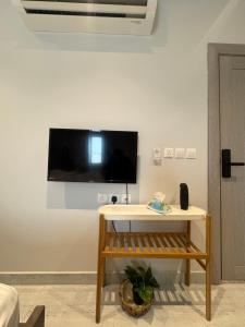 a living room with a tv on a wall at Modren AD 23 in Dammam
