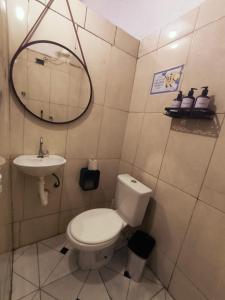 a bathroom with a toilet and a sink at Diadema Studio - Apt 11 in Diadema