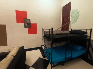 a room with two bunk beds and a door at Diadema Studio - Apt 11 in Diadema