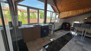 a living room with a washer and dryer in a house at Casa Raicu in Ploieşti