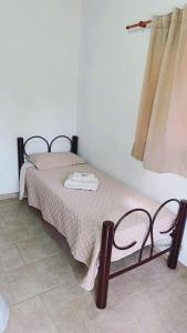 a small bed in a room with at Mi sueño apart en Mercedes Corrientes!!! in Mercedes +3 photos