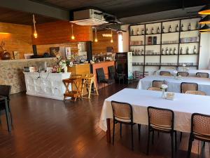 a restaurant with tables and chairs and a bar at The Canal Ratchaburi in Ratchaburi