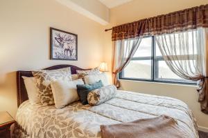 a bedroom with a bed with pillows and a window at Pool Access! Ski-In/Out Sugar Mtn Gem w/ Views in Sugar Mountain +27 photos