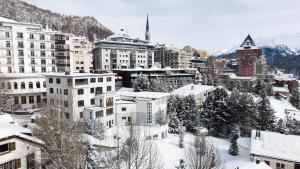 a city covered in snow with buildings at Villa Beaulieu in St. Moritz