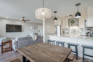 a kitchen and living room with a couch and a table at 214 Kihei Holiday in Kihei