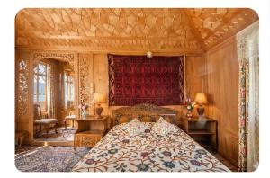 a bedroom with a bed with a red head board at The Martin's Houseboat in Srinagar