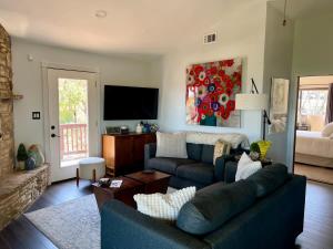a living room with a couch and a tv at Canyon Lake House with Lake View in Canyon Lake +30 photos