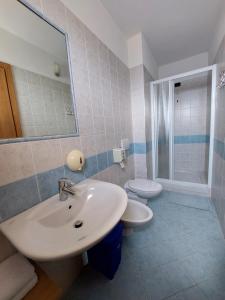 a bathroom with a sink and a toilet at Agriturismo Zertin in Gravedona +42 photos