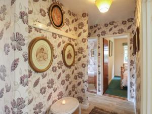a room with a wall with plates on it at The Lodge in Colchester +25 photos