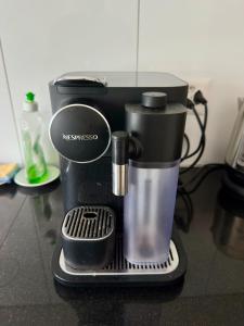 a black coffee maker sitting on a counter at Royal Apartment 02 in Schaan