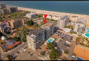 an aerial view of a city with a beach and buildings at Studio complex Miramare Nord in Năvodari