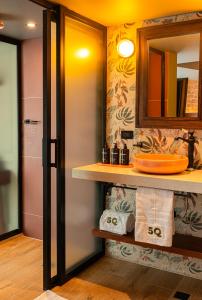 a bathroom with a sink and a mirror at 5Q House Chapinero in Bogotá +30 photos