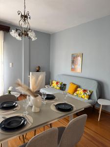 a living room with a table and a couch at Metani Residence in Skala Sotiros