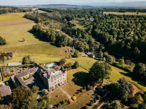 an aerial view of a castle on a green field at Askham Hall in Askham