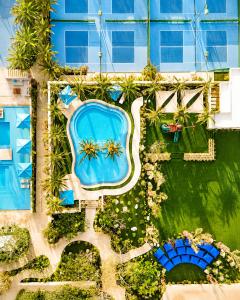 an overhead view of a swimming pool in a resort at Palmilla Dunes Luxury Residences in San José del Cabo