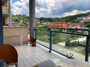 a balcony with a view of a city at Le Persiane Azzurre ovest in Albiano