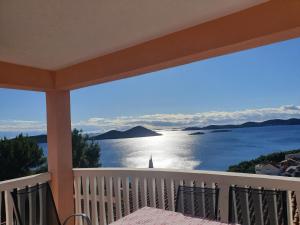 a balcony with a view of the water at Lavender Apartments in Drage +32 photos